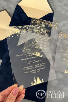 Acrylic invitations adorned with gold foil-stamped winter-themed patterns such as delicate snowflakes and pine trees. Navy Blue velvet envelopes are enclosed. Wedding Invitations Gold Foil, Snowflake Wedding, Gold Foil Wedding Invitations, Gold Wedding Invitations