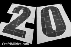 two pieces of paper with the numbers twenty and twenty printed on them, in black and white