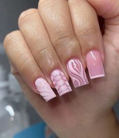 a woman's hand with pink and white nails