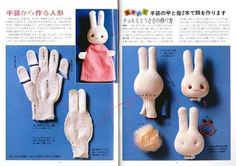 an open book with knitted bunny gloves and other items on it's pages