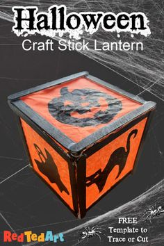 the halloween craft stick lantern is on display