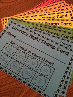 four different types of cards on a wooden table with the words library night stamp card