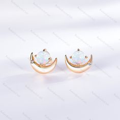 White Fire Opal Stud Earring Black German Fire Opal Post Rainbow Opal Earring 4.5mm Small Petite Stud Gift For Her Vintage Glass Opal Radiant Jewelry takes pride in offering handcrafted engagement rings that undergo rigorous quadruple-checks to ensure the highest quality. PRODUCT INFORMATION >Metal: SOLID 10K / 14K / 18K GOLD /S925 (can be made in white/rose/yellow gold) >Main Stone *Center Stone: White Fire Opal *Size & Shape: 4.5mm Round Cut >Side Stones: *Center Stone: Cubic Zircon / Diamond Rose Gold Round Crystal Earrings For Pierced Ears, Rose Gold Round Crystal Earrings, Rose Gold Celestial Earrings, Elegant Half Moon Earrings With Moon Charm, Rose Gold Celestial Earrings For Gift, Elegant Moon-shaped Crystal Earrings For Pierced Ears, Elegant Moon Shaped Crystal Earrings, Elegant Moon-shaped Crystal Earrings, Elegant Moon Phase Earrings