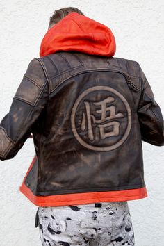 Go Super Saiyan with this Goku inspired mens leather jacket.This handcrafted brown leather jacket is perfect for fans of the original Dragon Ball series. #dragonball #goku #leatherjacket Goku Jacket, Mens Brown Leather Jacket, Leather Jacket Hoodie, Ball Character, Brown Leather Jacket Men, Leather Jackets Online, Brown Faux Leather Jacket, Red Orange Color, Leather Jacket With Hood