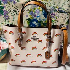 Questions? Leave A Comment Below! Coach Ck373 Mollie Tote 25 Rainbow Print Coated Canvas & Leather Crossbody Bag Product Details Printed Coated Canvas And Smooth Leather Zip-Top Closure, Fabric Lining Side Open Compartments Handles With 4 3/4" Drop Detachable Strap With 22" Drop For Shoulder Or Crossbody Wear 9 3/4" (L) X 7 1/2" (H) X 4 3/4" (W) Style No. Ck373 Coach Multicolor Everyday Bag, Trendy White Coach Bags, Multicolor Coach Crossbody Bag, White Coach Satchel For On-the-go, Coach Multicolor Top Handle Shoulder Bag, Multicolor Coach Top Handle Shoulder Bag, Coach Multicolor Top Handle Satchel, Multicolor Coach Shoulder Bag For On-the-go, Multicolor Coach Top Handle Satchel