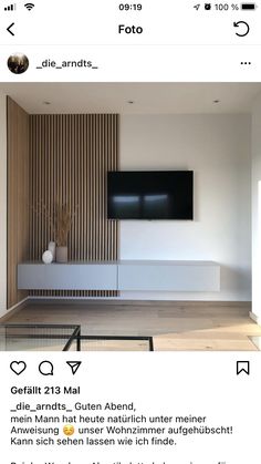 an image of a living room with white furniture and wood paneling on the walls