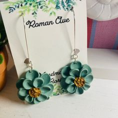 the earrings are made out of polymer flowers