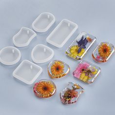 six plastic trays with flower designs on them