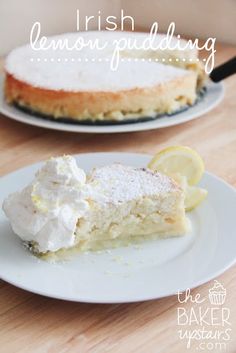 there is a piece of cake on the plate with lemons and whipped cream around it