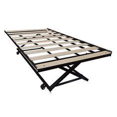 a metal bed frame sitting on top of a white floor