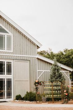 an outside view of a building with flowers on it