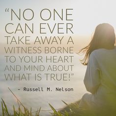 a woman sitting on top of a grass covered field next to the ocean with a quote from russell m nelson