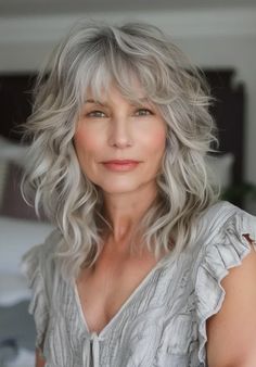 40 Prettiest Grey Hairstyles with Bangs That Prove Grey Is Glamorous Gray Hair Shag With Bangs, Medium Length Gray Hair With Layers Over 50, Long Wavy Gray Hair Over 50, Wolf Cut Grey Hair, Mid Length Gray Hair, Gray Hair Shag Haircut, Haircuts Medium Length Layers, Medium Length Grey Hair With Bangs