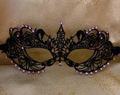 Black Lace Masquerade Mask with Glass Purple Violet Diamantes Black or Purple Double 6mm Satin Ribbons each side (Approx 1m) to secure your Mask Comfortable and Soft to wear all Evening Complete with Silver or Black Organza Carry Bag Measures: 8.5" by 3" Approx and will fit most Adults Beautiful Mask for any Special Occasion Masquerade Balls, Charity Event Balls, Hunt Balls New Year's Eve Party Christmas Party Proms Weddings Halloween Parties Black Adjustable Masquerade Mask For Party, Black Masquerade Mask For Halloween Wedding, Adjustable Black Masquerade Mask For Parties, Adjustable Mardi Gras Party Mask, Adjustable Masquerade Mask For Carnival Party, Adjustable Masquerade Mask For Halloween, Adjustable Purple Costume Accessories For Party, Fitted Halloween Masquerade Costume Accessories, Fitted Mask And Prosthetics For Halloween Party