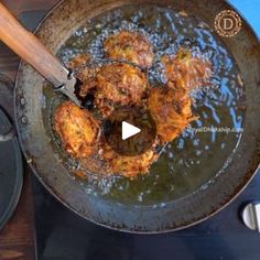 fried food being cooked in a frying pan