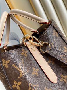 Description   L.V Montaigne MM Monogram Canvas For Women,  Shoulder And Crossbody Bags 13in/33cm LV M41056  Rep 1:1      Named for an elegant avenue in Paris, the Montaigne MM handbag is both chic and impeccably functional. Made from Monogram canvas, this model is an ideal business bag: its smartly designed interior is fitted with multiple pockets and compartments. Two top handles and a removable shoulder strap offer several stylish carry options.      33 x 23 x 15 cm / 13 x 9.1 x 5.9 inches (Length x Height x Width)   Monogram coated canvas  Burgundy microfiber lining  Gold-color hardware  Key bell  Hook to secure belongings  Central zipped compartment with padlock  2 wide compartments  Double smartphone pocket  Flat pocket  4 protective metal bottom studs  Strap:Removable, not adjustable Lv Montaigne, Louis Vuitton Montaigne, Mm Monogram, Business Bag, Monogram Canvas, Cowhide Leather, X 23, Bag Sale, Luxury Bags