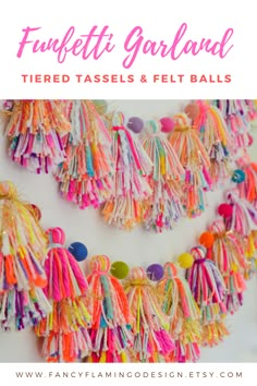 colorful tasselled garland hanging on the wall with text overlay that reads funfetti garland tiered tassels and felt balls