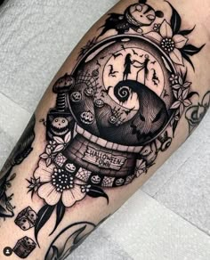 a black and white photo of a clock with flowers on it's arm that says time is money