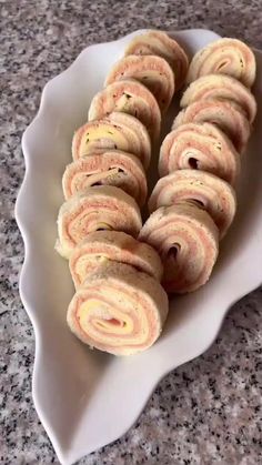 a white plate filled with cookies on top of a counter