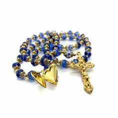 Gold Blue Crystal Rosary Handmade Gold Plated Catholic Rosary Necklace Total Length Of 20". Beautiful 9mm Crystallized Beads With Round Blue Flower Beads Made Of Ceramic. Golden 1.6" Cross Made Of Zinc And Coated With Gold, Preventing Corrosion, Assure Durability For Years. Cross (H X W) : 4 cm / 1.6", Rosary length 21", packed in purple gift velvet Bag. Spiritual natural beads are used as prayer meditation rosary or a religious necklace, a wonderful gift for any occasion, birthday, Confirmation Crystal Rosary, Pearl Rosary, Purple Gift, Catholic Rosary, Rosary Necklace, Rosary Catholic, Flower Beads, Handmade Gold, Velvet Bag