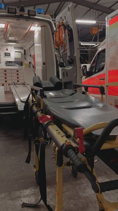 an ambulance is parked in the garage with its doors open and it's seats folded down