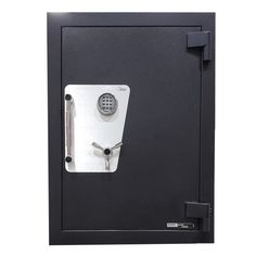 a black and white photo of a safe with the door open to show it's key lock