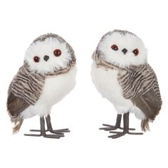 two stuffed owls sitting next to each other