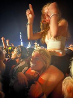 a group of people sitting next to each other at a concert