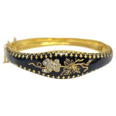 This Vintage Victorian-style bracelet exudes classic elegance with its intricate enameled detailing. Crafted in 14k gold and weighing 18.3 grams, it showcases 0.75 carats of diamonds with VS2-SI1 clarity and G color, adding a subtle sparkle to the piece. Designed to fit up to an 8-inch wrist, this bracelet combines timeless beauty with a luxurious feel. The vintage aesthetic and fine craftsmanship make it a perfect statement accessory. Ideal for those who appreciate historical-inspired jewelry with a touch of sophistication. Key Features: Vintage Victorian style bracelet. Enameled. 0.75ct total diamond. VS2-SI1 clarity. G color. 18.3 grams. 14k gold. Can fit up to 8" wrist. Luxury Yellow Gold Victorian Cuff Bracelet, Luxury Victorian Gold Collectible Bracelet, Edwardian Engagement Ring, Modern Bracelets, Ruby Diamond Rings, Garnet Bracelet, Engraved Bracelet, Bracelet Vintage, Inspired Jewelry