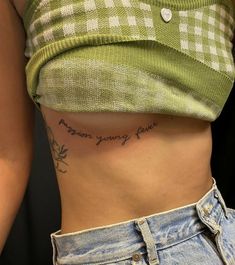 a woman's stomach with the words dear young power written on her left side