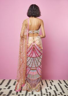 A pre-stitched biscuit nude tulle saree fully embellished with gold reflective acrylics and sequins. Fully embellished bralette in glass cut dana and 3D embellished straps.From Papa Don’t Preach’s Zsa Zsa Zsu collection. DELIVERY TIMEPlease allow 8-12 weeks for your outfit to arrive. FABRIC DETAILSTulle Professional cleaning only. Papa Don't Preach, Embellished Saree, The It Girl, Backless Blouse Designs, Indian Dresses Traditional, Traditional Indian Outfits, Indian Bridal Wear, Indian Bridal Outfits, Stylish Sarees