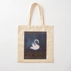 a tote bag with an image of a white swan on it's side