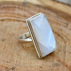 Rectangular Moonstone Ring Gift, Elegant Rectangular Rings With Natural Stones, Elegant Rectangular Natural Stone Rings, Sterling Silver Crystal Ring With Rectangular Gemstone, White Sterling Silver Jewelry With Rectangular Stone, Silver Rectangular Moonstone Ring Gift, Rectangular Silver Moonstone Ring Gift, White Rectangular Sterling Silver Ring, White Rectangular Gemstone Rings