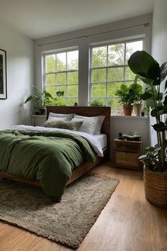 a bedroom with a bed, plants and pictures on the wall