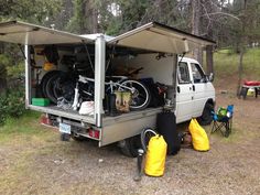 a camper van with bikes in the back