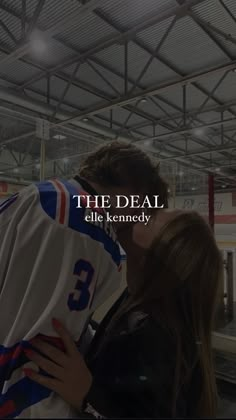 a couple kissing in front of a hockey jersey with the caption, the deal