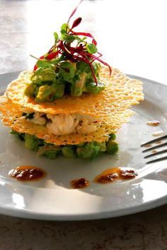 a white plate topped with food on top of a table