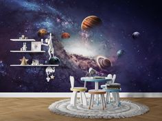 a space themed wallpaper mural in a dining room