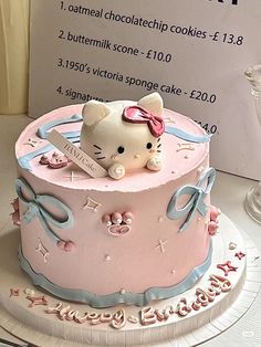 a hello kitty birthday cake on a table