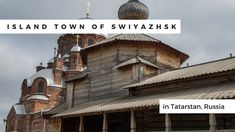 an old wooden building with a dome on top and the words island town of swiazzahsk in russian