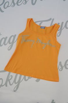 Thierry Mugler Logo Bust Tank Top Sleeveless Shirt Sleeveless Tank Top With Logo Print For Summer, Summer Sleeveless Tank Top With Logo Print, Vintage Yellow Sleeveless Top, Orange Sleeveless Cotton Tank Top, Orange Cotton Sleeveless Tank Top, Casual Orange Cotton Vest, Retro Orange Sleeveless Top, Fitted Orange Cotton Tank Top, Mugler Logo