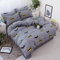 batman bedding set in grey with yellow and black logos on the comforter cover