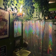 a bathroom with a shower curtain covered in holographics next to a sink