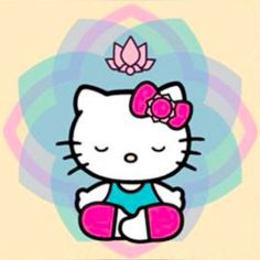 hello kitty sitting on the ground with a flower in her hair and wearing a bathing suit