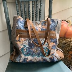 Like-New/Nwot Condition Myra Weekend Bag In Mixed Media Textiles: Cotton, Leather, Denim, Cow Hide. Keys Hooks, Front And Back Zippered Pockets, Top Zipper, Inner-Zippered Pocket, Two Slide Pockets. Blue, Brown, Gray Colors. Beautiful Embroidered Design On Front. Laying Flat: 17” Wide; 14” High; Approximately 5” Width Bohemian Shoulder Bag With Large Capacity For On-the-go, Bohemian Rectangular Shoulder Bag With Zipper, Blue Hobo Shoulder Bag For Daily Use, Bohemian Shoulder Bag With Zipper Closure, Bohemian Blue Canvas Bag For Everyday Use, Blue Bohemian Bags With Handles, Bohemian Brown Satchel For On-the-go, Bohemian Shoulder Bag With Zipper, Blue Bohemian Satchel For Travel