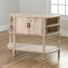 a white wooden table with two drawers on one side and an open shelf on the other