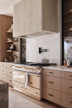 a kitchen with an oven, stove and counter tops in it's center island