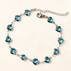 Make An Everyday Statement With This Beautiful Bracelet. Featuring Bright Blue Hearts In A Silver Toned Setting. This Stunning Bracelet Will Bring Joy And Make Any Outfit Come Alive. Make Lasting Memories With This Fun And Fashionable Accessory! Bracelet Measures Approx. 6.75” With A 1.5” Extender Also Available In Gold Toned. More Color Options Available. See My Other Listings For More Jewelry. Bundle To Save On Shipping. #B38 Elegant Blue Bracelets For Valentine's Day, Blue Heart-shaped Bracelets For Gifts, Blue Heart-shaped Gift Bracelets, Blue Bracelets With Heart Charm Gift, Blue Heart Charm Bracelets As Gifts, Blue Heart-shaped Bracelets For Valentine's Day, Blue Heart-shaped Bracelet For Valentine's Day, Elegant Blue Bracelets With Heart Charm, Elegant Blue Bracelet With Heart Charm