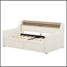 a white bed with two drawers underneath it