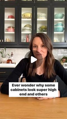 a woman sitting at a kitchen table with a sign in front of her that says, ever wonder why some cabinets look super high end and other